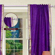 Purple sari rod pocket curtains hung at a window