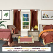 Brown sari tab top curtains hung at a window