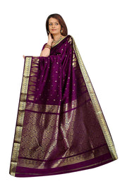 Magenta art silk sari shown draped on a model