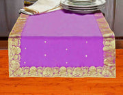 Calming lavender silk table runner running down a dining table