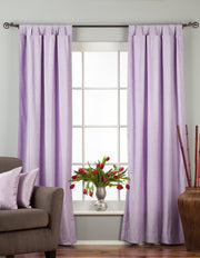Lavender velvet tab top curtains hung at a window
