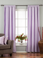 Lavender velvet tab top curtains hung at a window