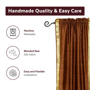 Brown sari rod pocket curtains hung at a window