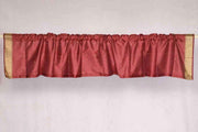 Maroon sari valance mounted above a window