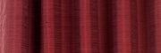 Maroon raw silk ring top curtains hung at a window