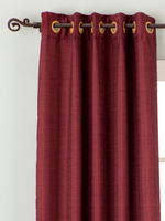 Maroon raw silk ring top curtains hung at a window