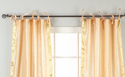 Misty rose sari tie top curtains hung at a window