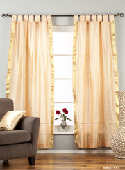 Misty rose sari tab top curtains hung at a window