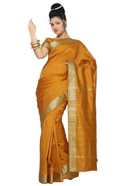 Mustard art silk sari shown draped on a model