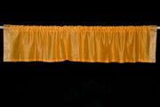 Mustard sari valance mounted above a window