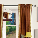 Brown sari rod pocket curtains hung at a window