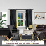 Black sari tab top curtains hung at a window