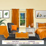 Mustard sari rod pocket curtains hung at a window