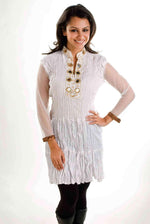 Off white poly crepe kurti tunic shown draped on a model