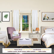 White sari rod pocket curtains hung at a window