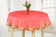 Peach sari tablecloth laid on a dining table