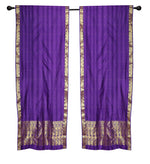 Purple sari rod pocket curtains hung at a window