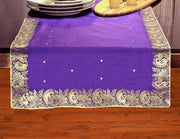 Regal purple silk table runner running down a dining table
