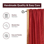 Fire brick sari rod pocket curtains hung at a window