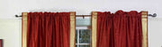 Rust sari rod pocket curtains hung at a window