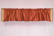 Rust sari valance mounted above a window