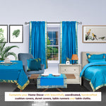 Turquoise sari rod pocket curtains hung at a window