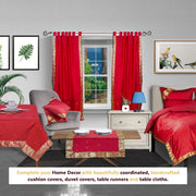 Maroon sari tab top curtains hung at a window