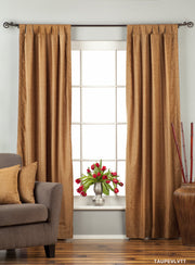 Taupe velvet tab top curtains hung at a window