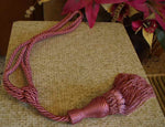 Peach sari curtain tiebacks holding a panel open