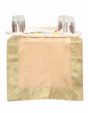 Gold silk table runner running down a dining table