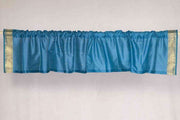 Turquoise sari valance mounted above a window