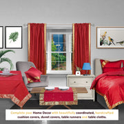Fire brick sari rod pocket curtains hung at a window