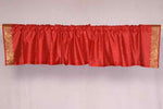 Fire brick sari valance mounted above a window