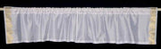 White sari valance mounted above a window