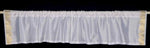 White sari valance mounted above a window