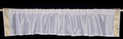 White sari valance mounted above a window