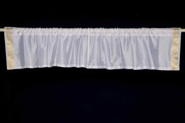 White sari valance mounted above a window
