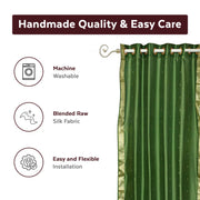 Forest green sari grommet top curtains hung at a window
