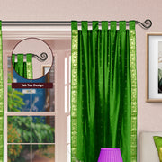 Forest green sari tab top curtains hung at a window