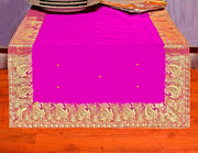 Violet silk table runner running down a dining table