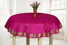 Violet sari tablecloth laid on a dining table