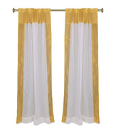 White sheer tissue rod pocket curtains hung at a window