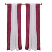 Maroon sheer tissue rod pocket curtains hung at a window