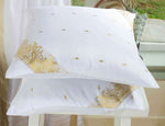 White sari cushion covers arranged on a sofa