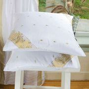 White sari cushion covers arranged on a sofa
