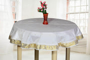 White sari tablecloth laid on a dining table