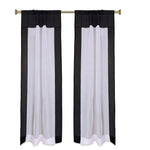 Black sheer tissue rod pocket curtains hung at a window