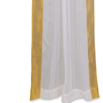 White sheer tissue rod pocket curtains hung at a window