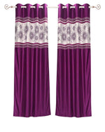 Wine sari grommet top curtains hung at a window