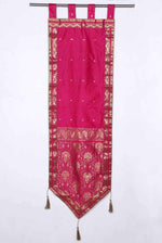 Pink sari wall hanging displayed on a wall